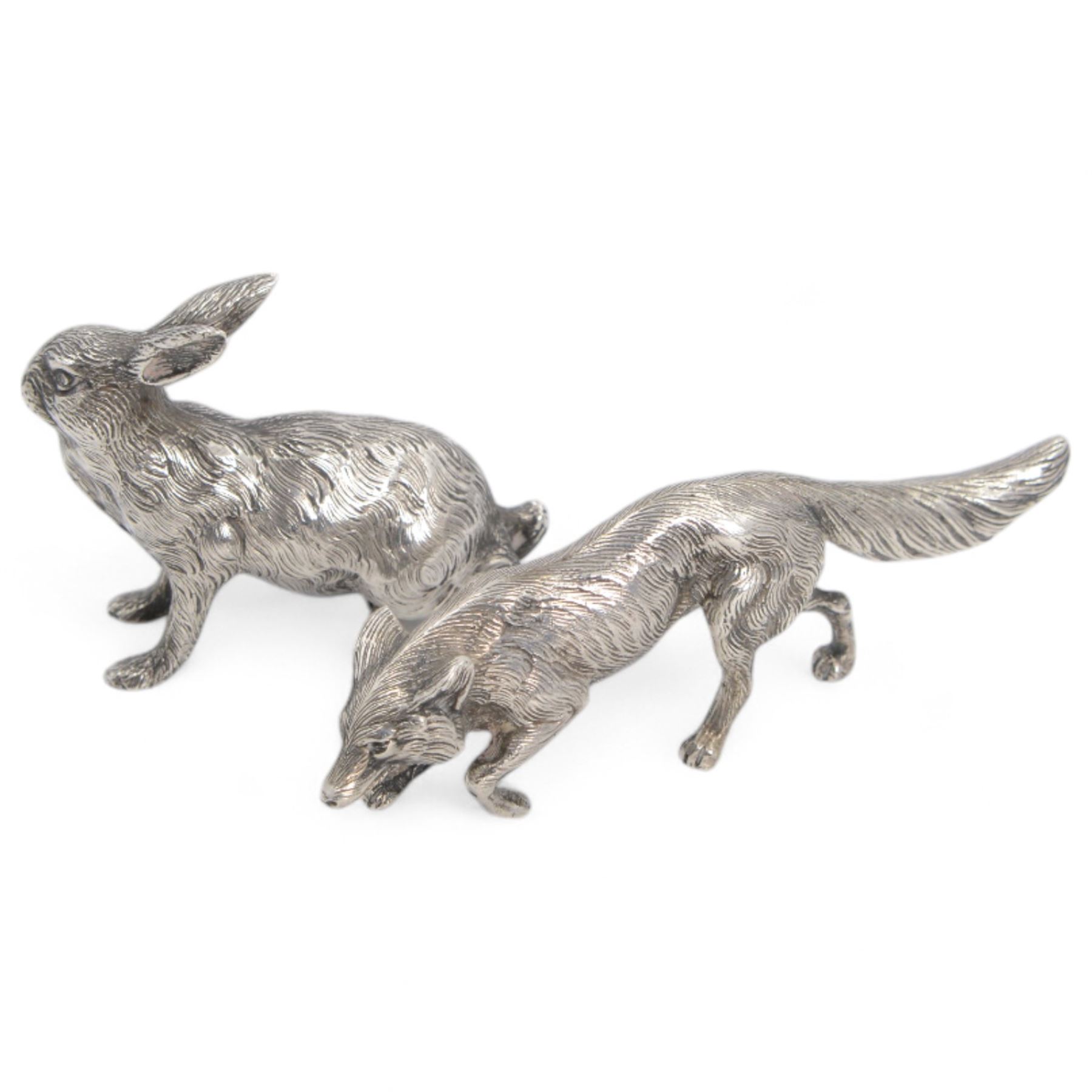 German silver model of a prowling fox, stamped Germany Sterling to underside of tail, together with a Continental silver model of a hair, with London import mark for 1971, tallest H6cm 