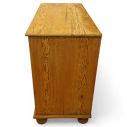 Victorian stripped pine chest, rectangular top over two short and two long drawers with turned wooden knob handles, on bun feet