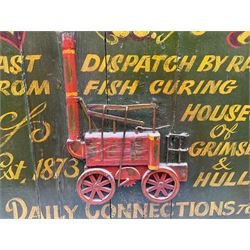 `The Grimsby-York Railroad Co.` painted wooden railway advertising sign 20th century, of planked construction with arched top and moulded border, decorated with an applied wood and metal image of an early steam locomotive in relief, the surrounding wording reading `The Grimsby-York Railroad Co., Fast Dispatch by Rail from Fish Curing Houses of Grimsby & Hull, Est. 1873, Daily Connections to Billingsgate`, 89 x 71cm
