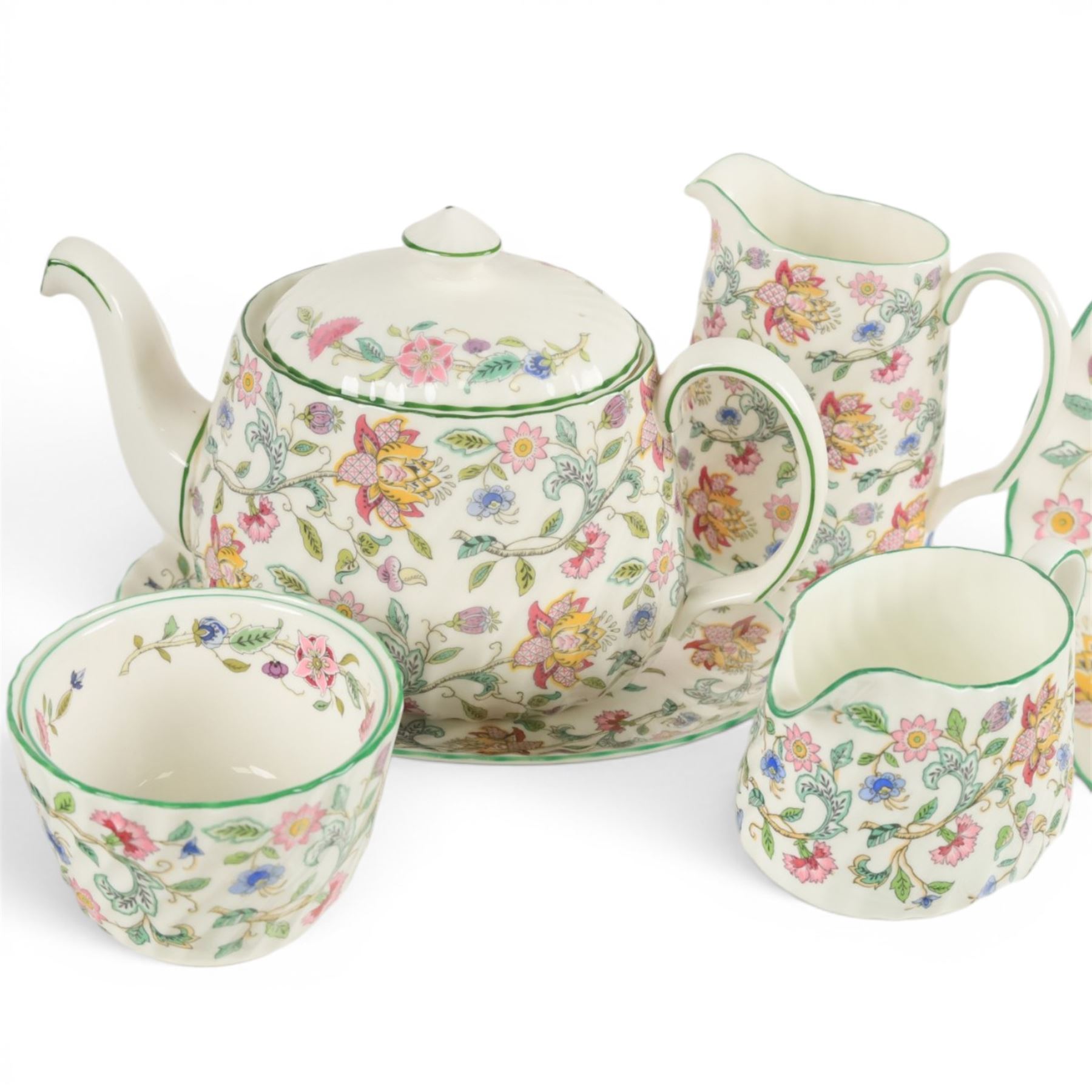 Minton Haddon Hall tea and dinner service, including teapot, milk jug, hot water jug, open sucrier, ten teacups and eight saucers, eight dinner plates, eight soup bowls, etc 