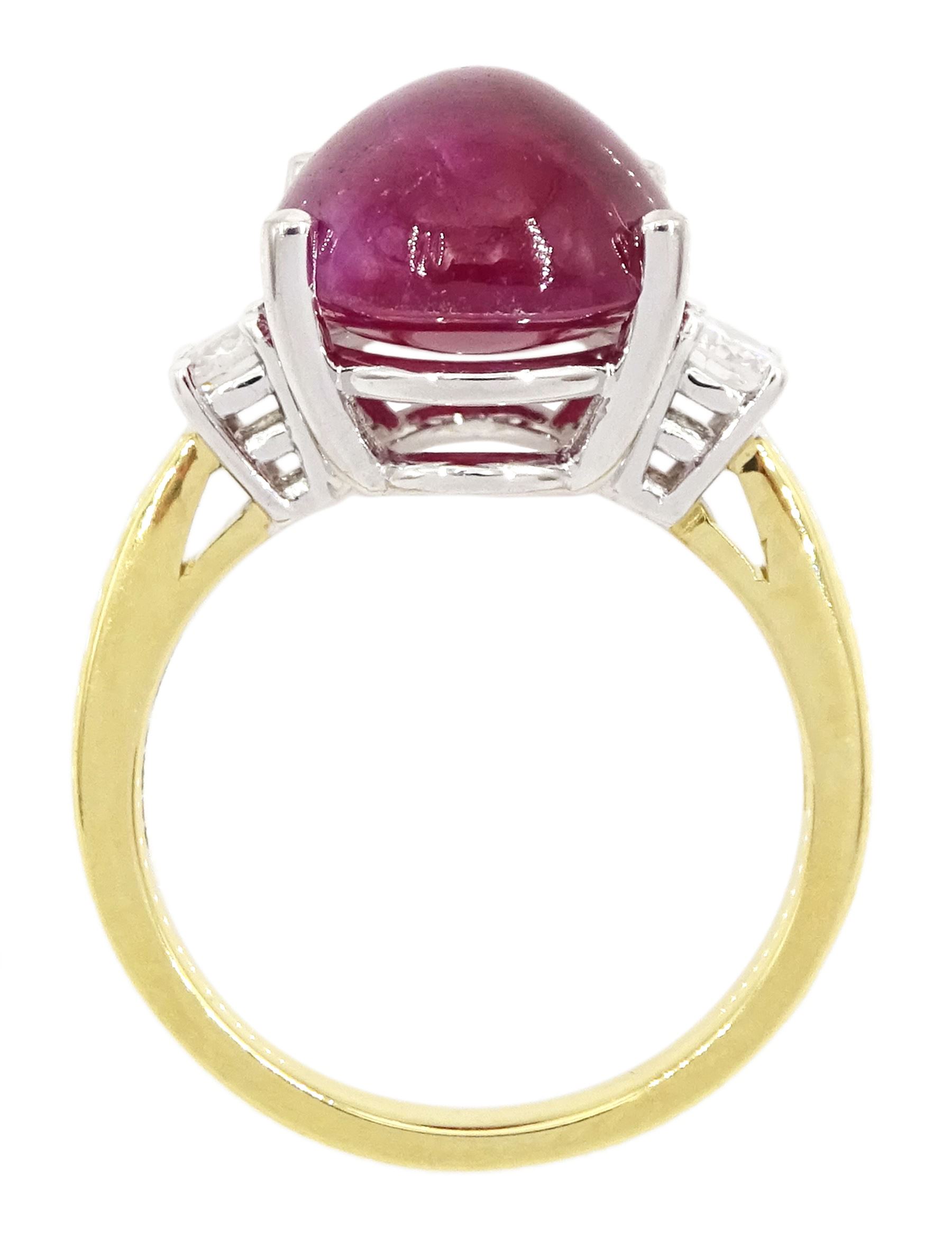 18ct gold ruby and diamond three stone ring, oval cabochon cut ruby of approx 11.40 carat, with a single round brilliant cut diamond set either side, hallmarked