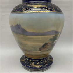 19th century Vienna style porcelain 'Musik' garniture, the central vase of baluster form with domed cover flanked by two smaller vases with twin curved gilt handles to short neck, each decorated with classical figural vignettes between blue borders heightened with gilt, H33.5cm