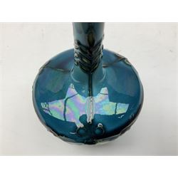 Minton Secessionist vase, with tube-lined stylised flower decoration, upon a blue ground, with printed mark to base 'Minton Ltd, No. 32', H13cm