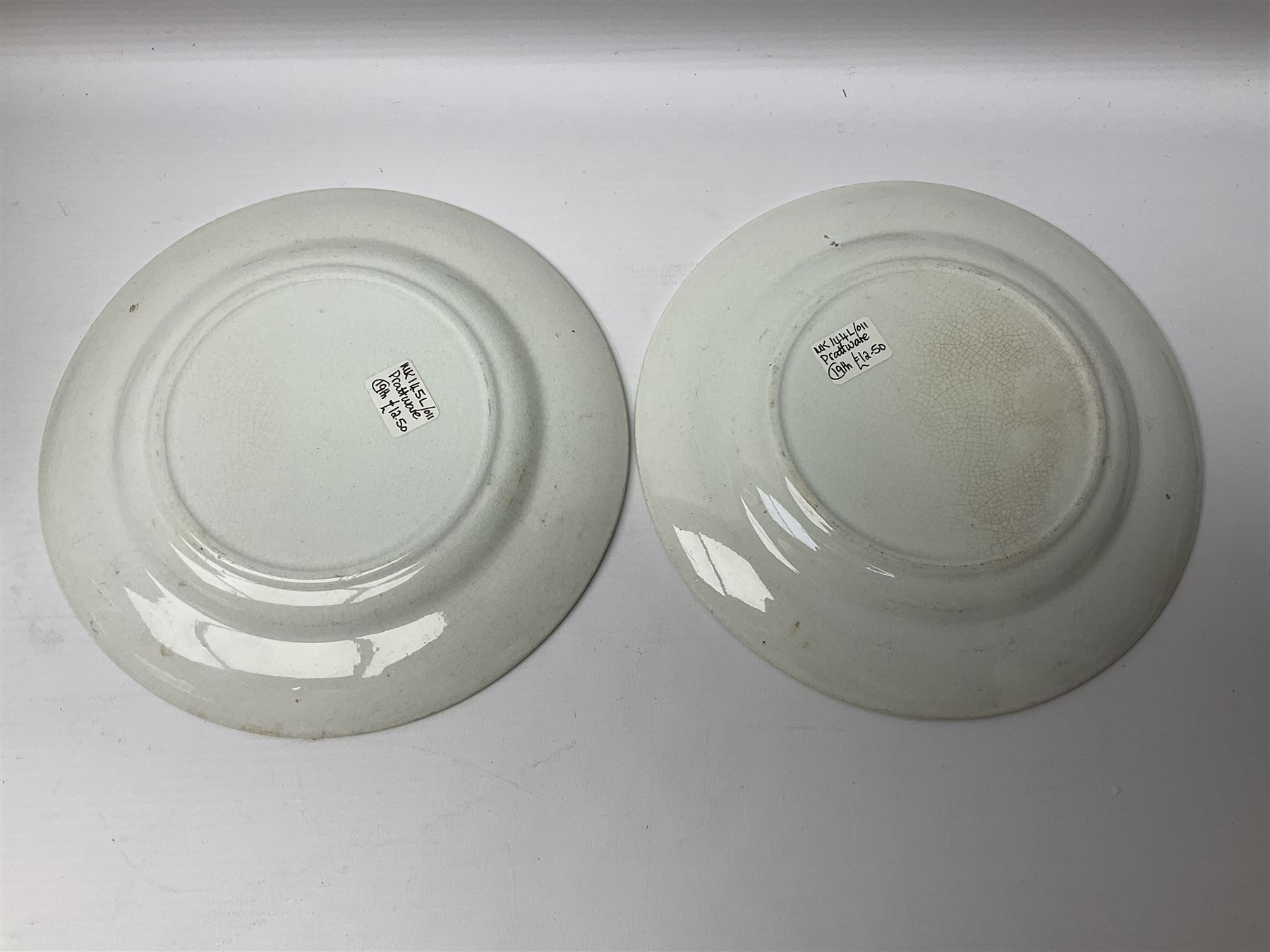 19th century Prattware table ware to include an oval footed dish decorated with a scene after Landseer 'Highland Music', retailed by James Muggleton L27.5cm, ‘The Truant’ plate after T. Webster, 'Blind Man's Buff' & 'Snap Dragon' tea plate, two side plates with malachite printed borders and others (17)