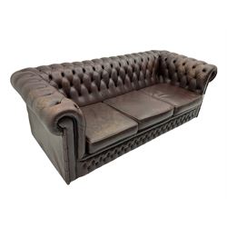 Chesterfield style three seat sofa, upholstered in buttoned burgundy leather