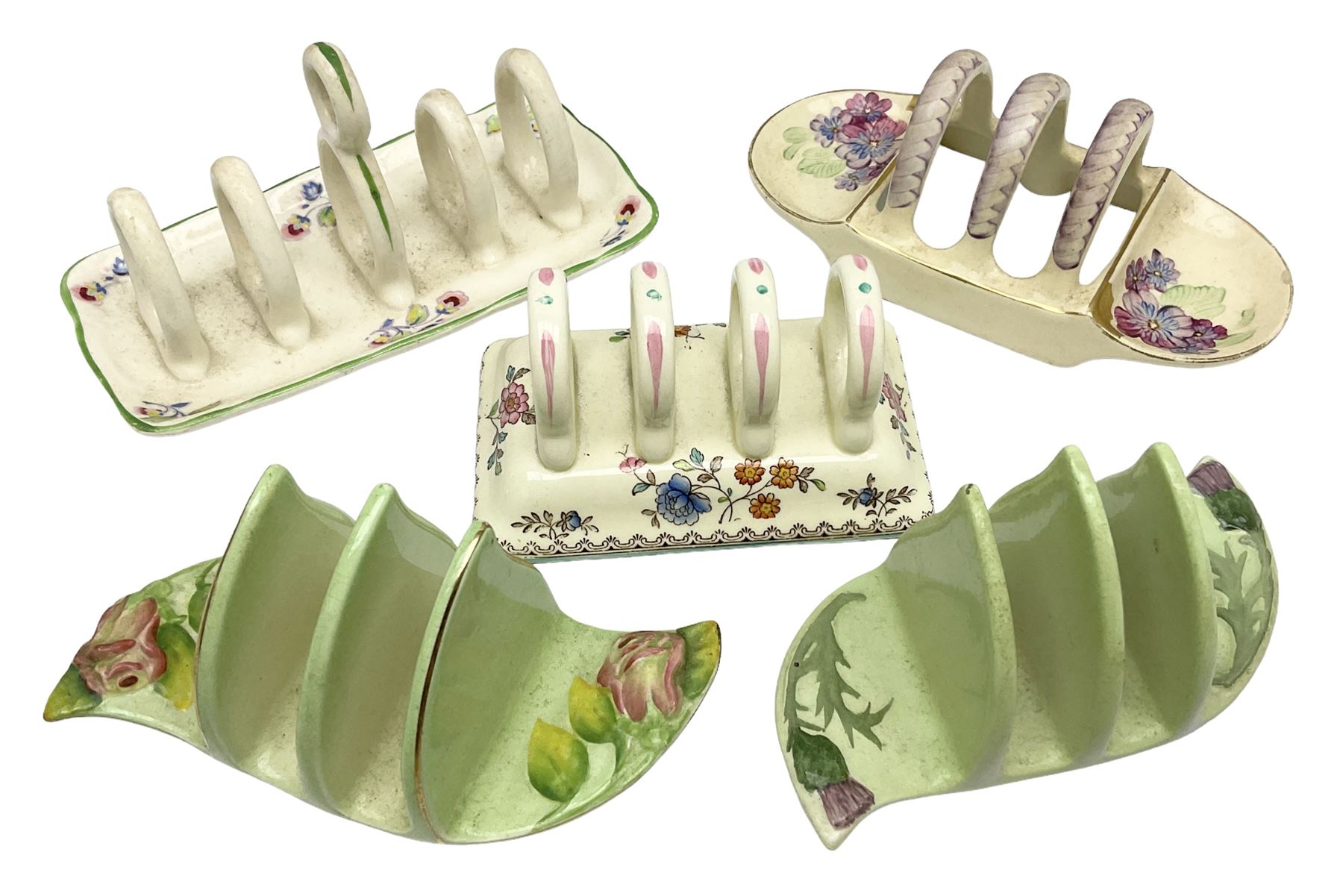 Collection of five toast racks comprising two Royal Winton Grimwades, Gray's Pottery, Copeland Spode Audley Royal Jasmine and another further early-mid 20th century toast rack decorated with flowers