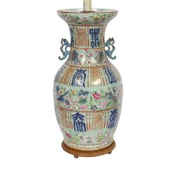 Early 20th century Chinese celadon ground vase, converted to lamp, of baluster form with flared neck and applied twin scroll handles to shoulders, the body decorated with polychrome enamels of birds amongst flowering branches, between bands of archaistic characters in blue, iron red and gilt, including fittings H60cm
