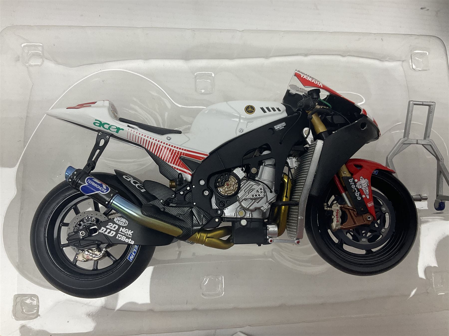 Three Ixo Models 1:12 scale die-cast models of motorcycles - BRB007 Honda NSR500 Michael Doohan 1998; BRB001 Honda RC211V Valentino Rossi 2003; and Yamaha YZR-M1 Colin Edwards MotoGP Phillip Island 2007; all boxed (3)