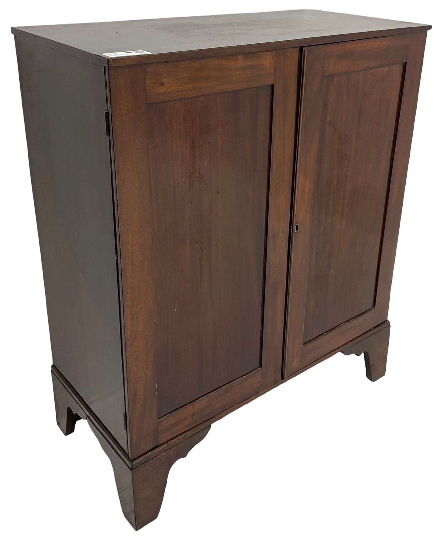 19th century mahogany collector's cabinet, crossbanded rectangular top over two panelled doors, the interior fitted with seven shallow drawers, on bracket feet