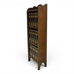 Small Edwardian mahogany open bookcase with Charles Dickens books, oak bookcase with galleried top, containing fifteen hardback books  