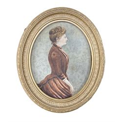 English School (19th century): Side Profile Three Quarter Length Portrait of a Victorian Lady, watercolour indistinctly signed and dated 1888, housed in gilt oval frame 25cm x 20cm