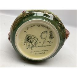 Royal Doulton Wandering Minstrel loving cup modelled by Charles Noke, decorated with figures with a castle in the background, mark to base 'A Wandering Minstrel A Merry Man Moping Mum' limited edition 7/600, H14cm