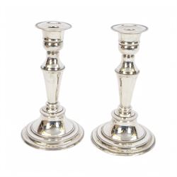 Pair of late 20th century silver mounted candlesticks, of tapering form with beaded rims, hallmarked Cooper Brothers & Sons Ltd, Sheffield 1972, H20cm