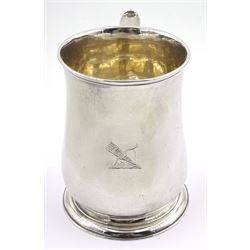 George II silver mug, of bellied form with capped scroll handle, the body engraved with a quiver of arrows, upon a circular stepped foot, hallmarked London 1740, makers mark indistinct, H11.5cm, approximate weight 10.22 ozt (318 grams)