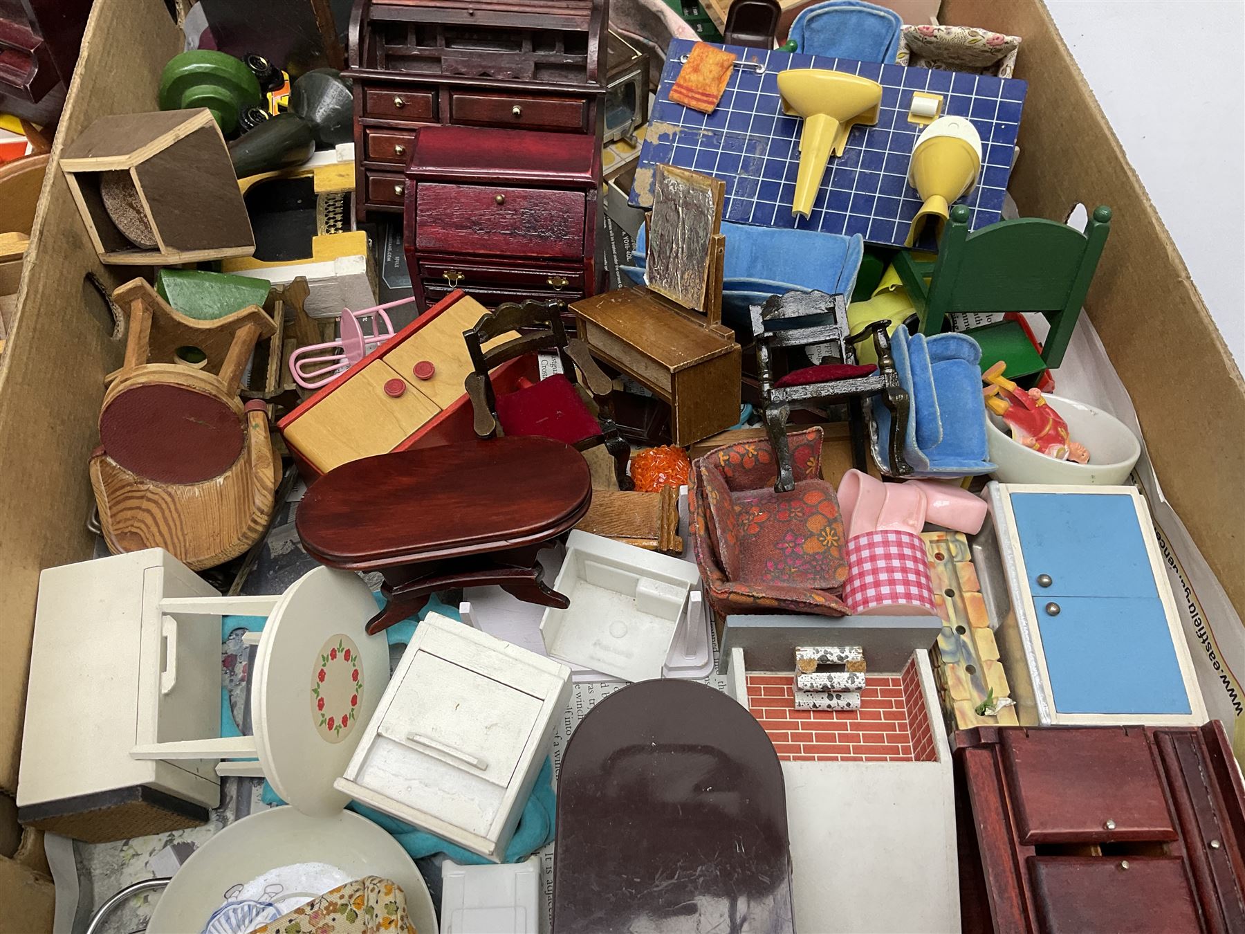 Large quantity of 1970s doll's house furniture, predominantly stained or painted wooden, including lounge, dining room, kitchen and bedroom pieces, bathroom fittings, bureaux and desks, piano, lamps, fire-surrounds etc; various scales