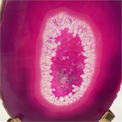 Pair of pink agate slices, polished with rough edges raised upon gilt metal stands, H20cm