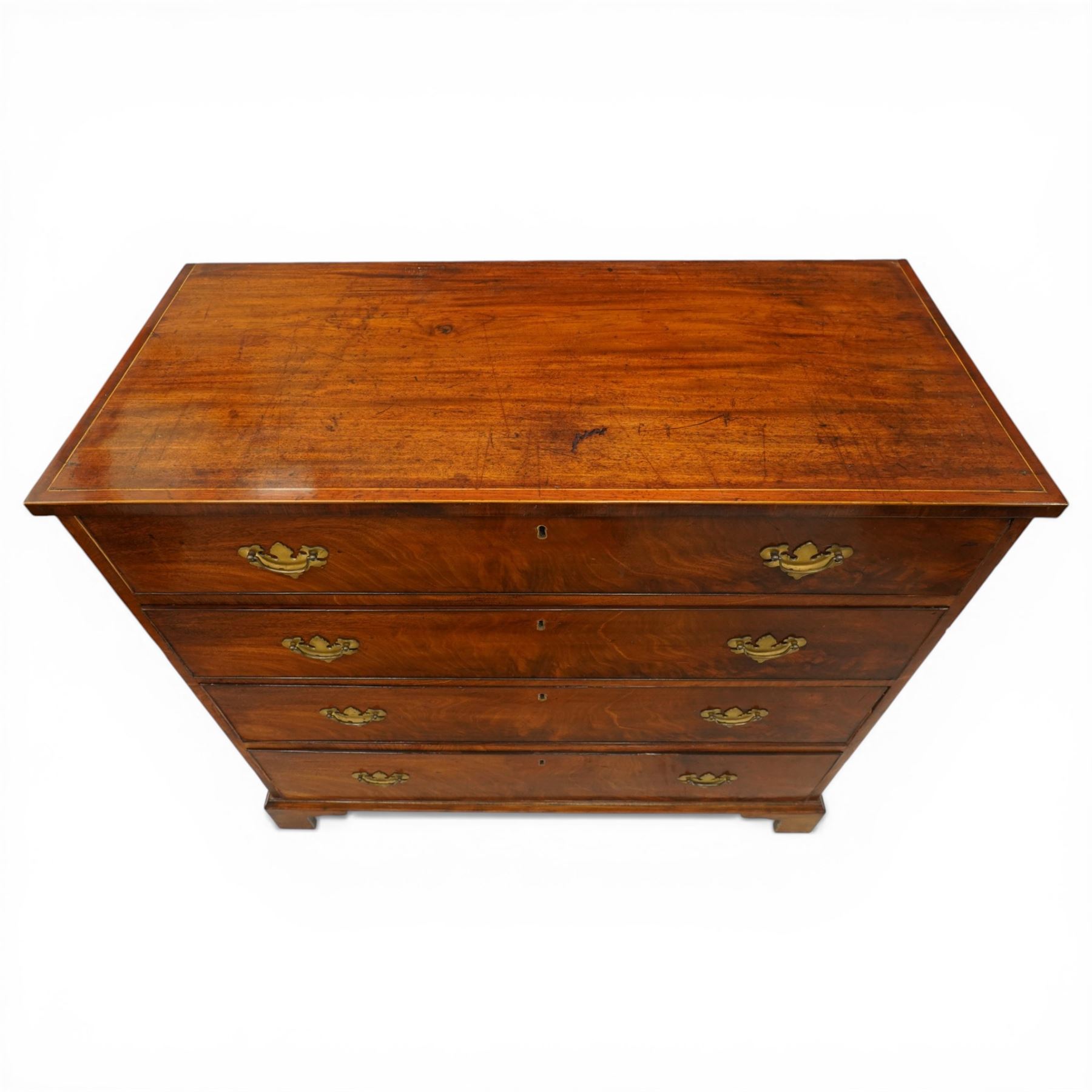 19th century mahogany straight-front chest, rectangular top with cross-banded edge, fitted with four long graduating cock-beaded drawers, lower moulded edge over bracket feet