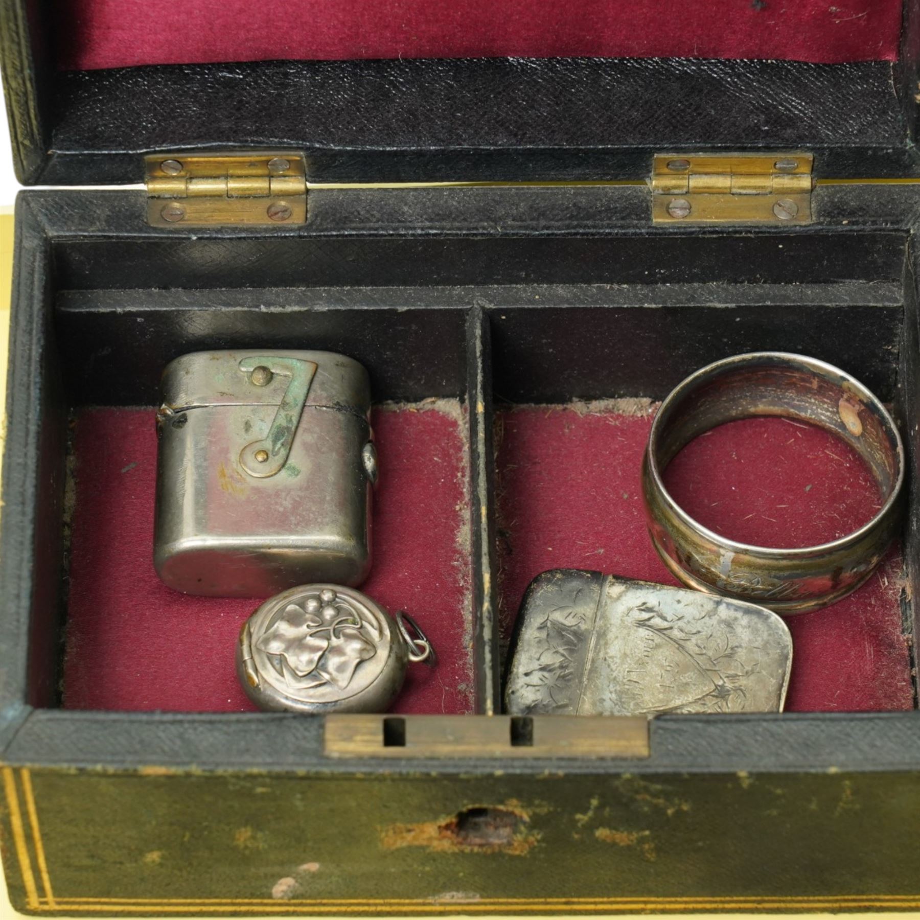Silver bladed and mother of pearl butter knife, silver vesta case, 19th century papier mache snuff box, sterling silver folding glove button hook, silver cheroot holder, napkin ring, plated combination vesta and compass, other small items and a leather jewellery box
