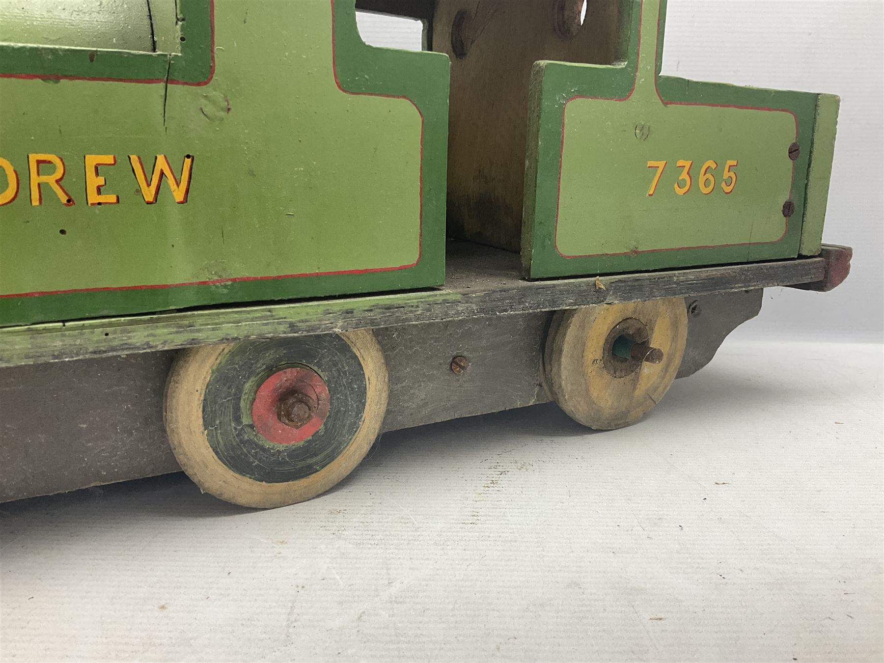 1960s scratch-built green, black and red painted wooden model of a 4-6-0 tank locomotive 'Andrew' No.7365 L88cm; and an unused wall mounting die-cast model display cabinet with glass door and shelves 52 x 40cm (2)