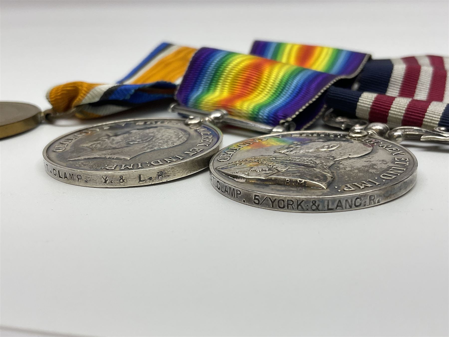 WW1 Military Medal group of three comprising MM, British War Medal and Victory Medal awarded to 44772 Pte. T. Clamp 5/York: & Lanc: R.; all with ribbons on hanging bar