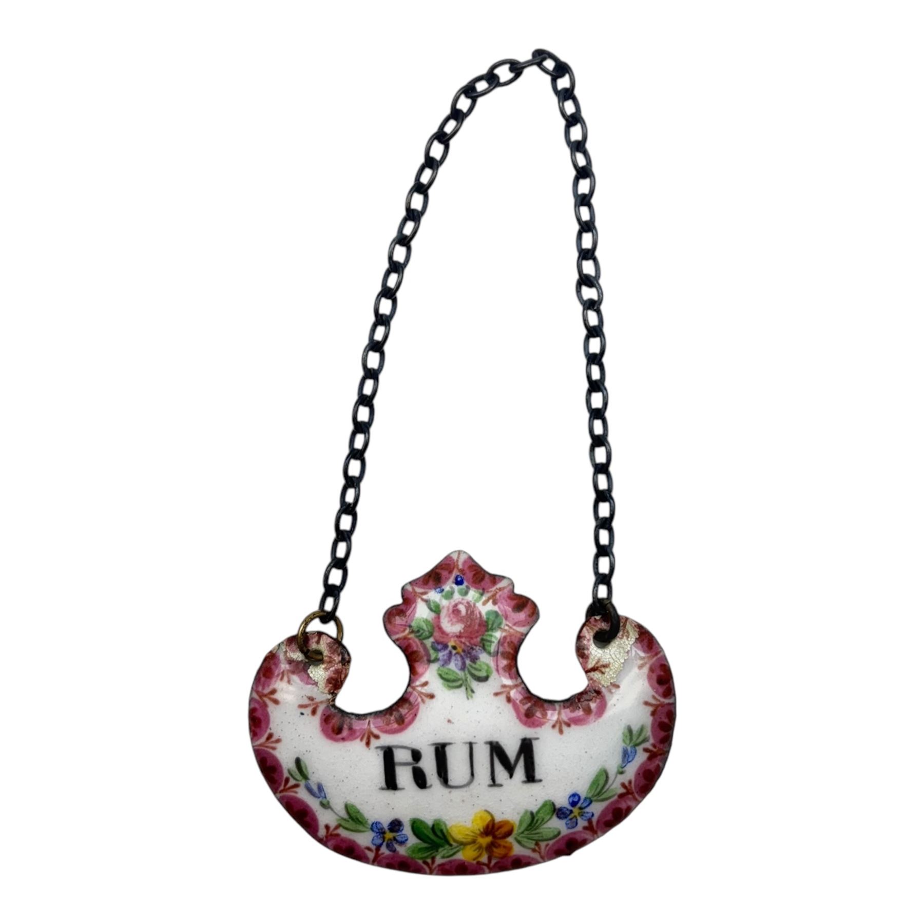 Seventeen mid 18th century and later enamel wine labels, one example of heart shaped form, the rest of cartouche and escutcheon form, various titles including Claret, Rum, Sloe Gin, Port, Whisky, Cowslip, Cherry-Brandy, etc., largest example W7cm 