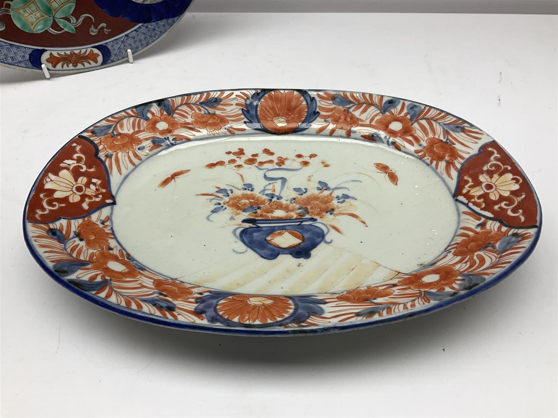Two 19th century Japanese Imari pattern oval charger together with another circular Imari charger, circular charger D31cm 