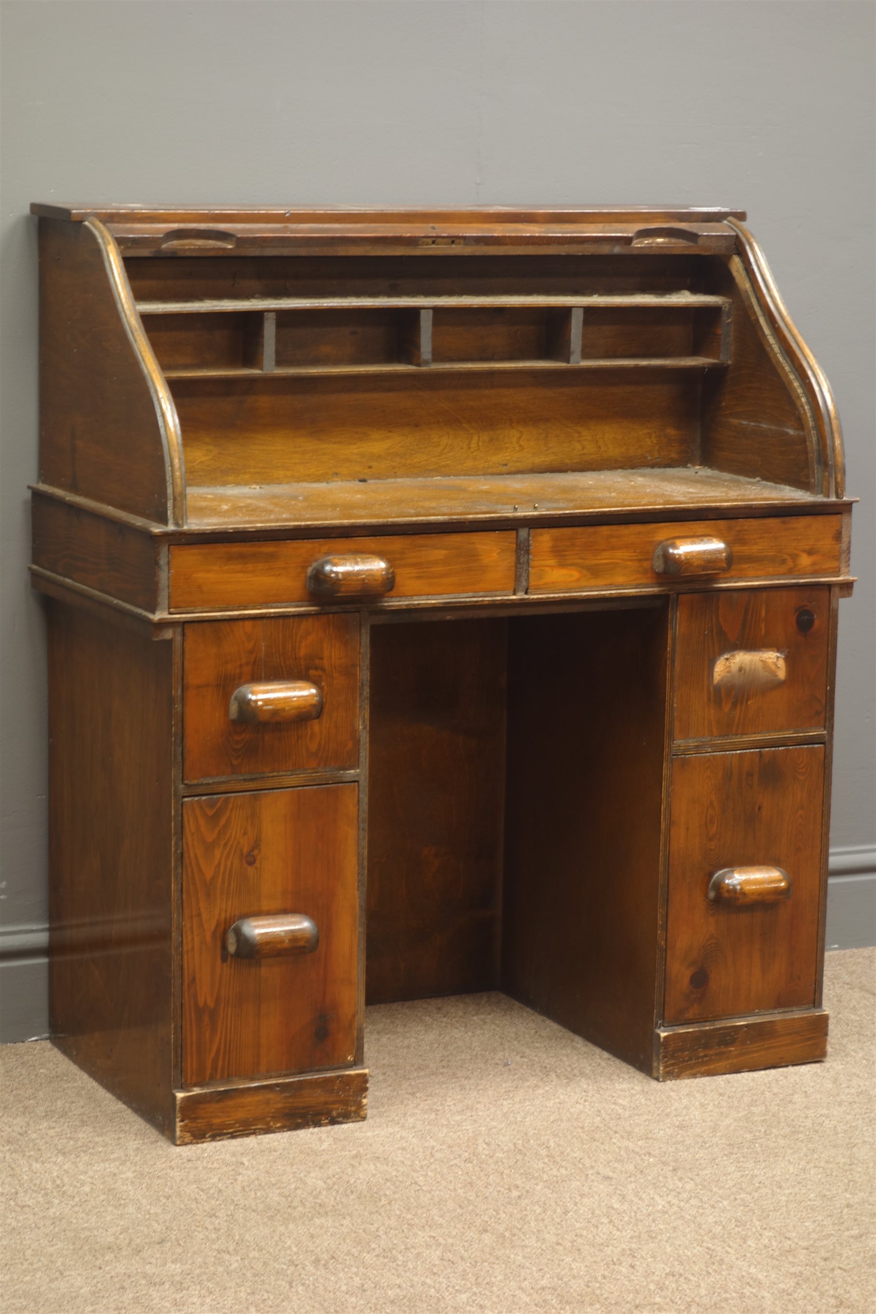 Mid 20th century small pine pedestal tambour roll top desk, fitted