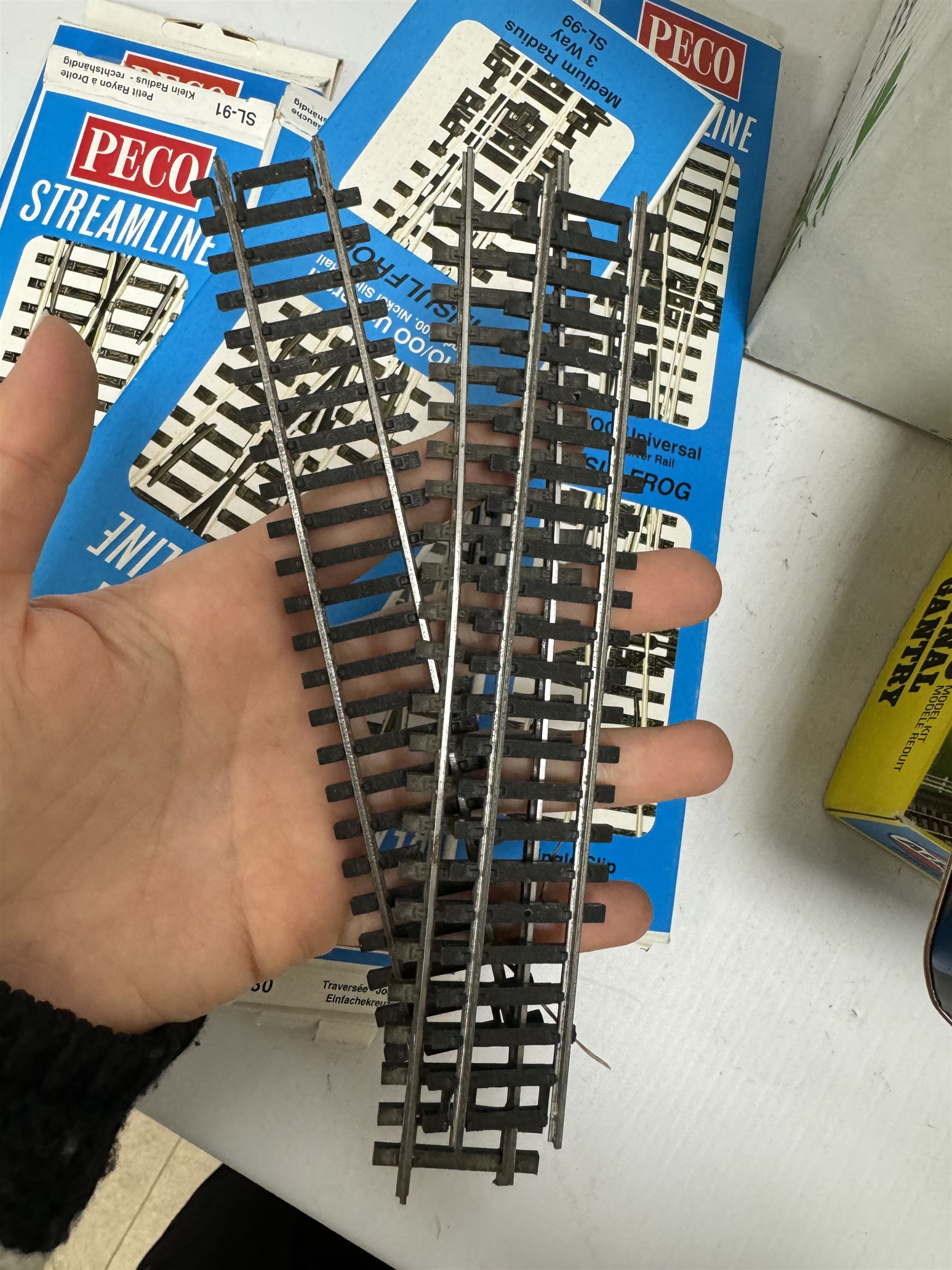 Collection of '00' gauge model railway accessories, including Peco Streamline and Insulfrog track, Metcalfe Platform kit, kit built model railway buildings and other accessories