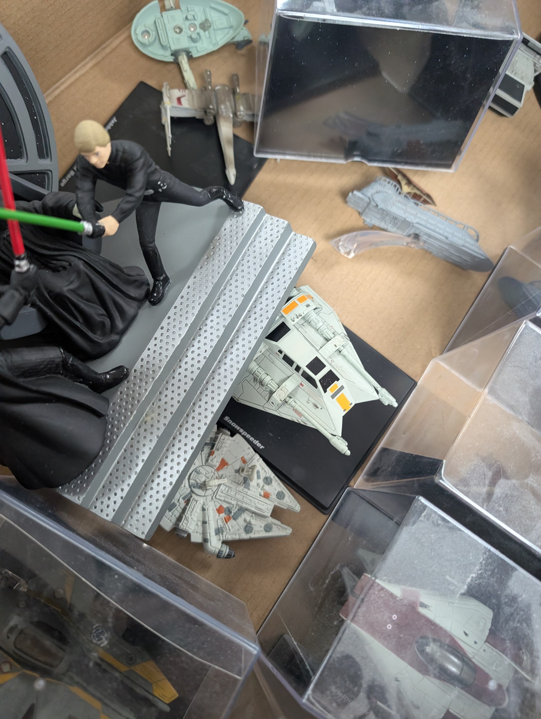 Collection of DeAgostini Star Wars figures, including two limited edition Darth Vader figures, diecast vehicles and figures and miniature helmets
