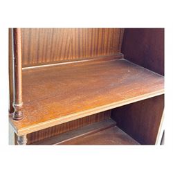 Mid-20th century mahogany open bookshelf, the rectangular top with a brass balustrade gallery, over three shelves each supported by turned column uprights, on shaped apron base