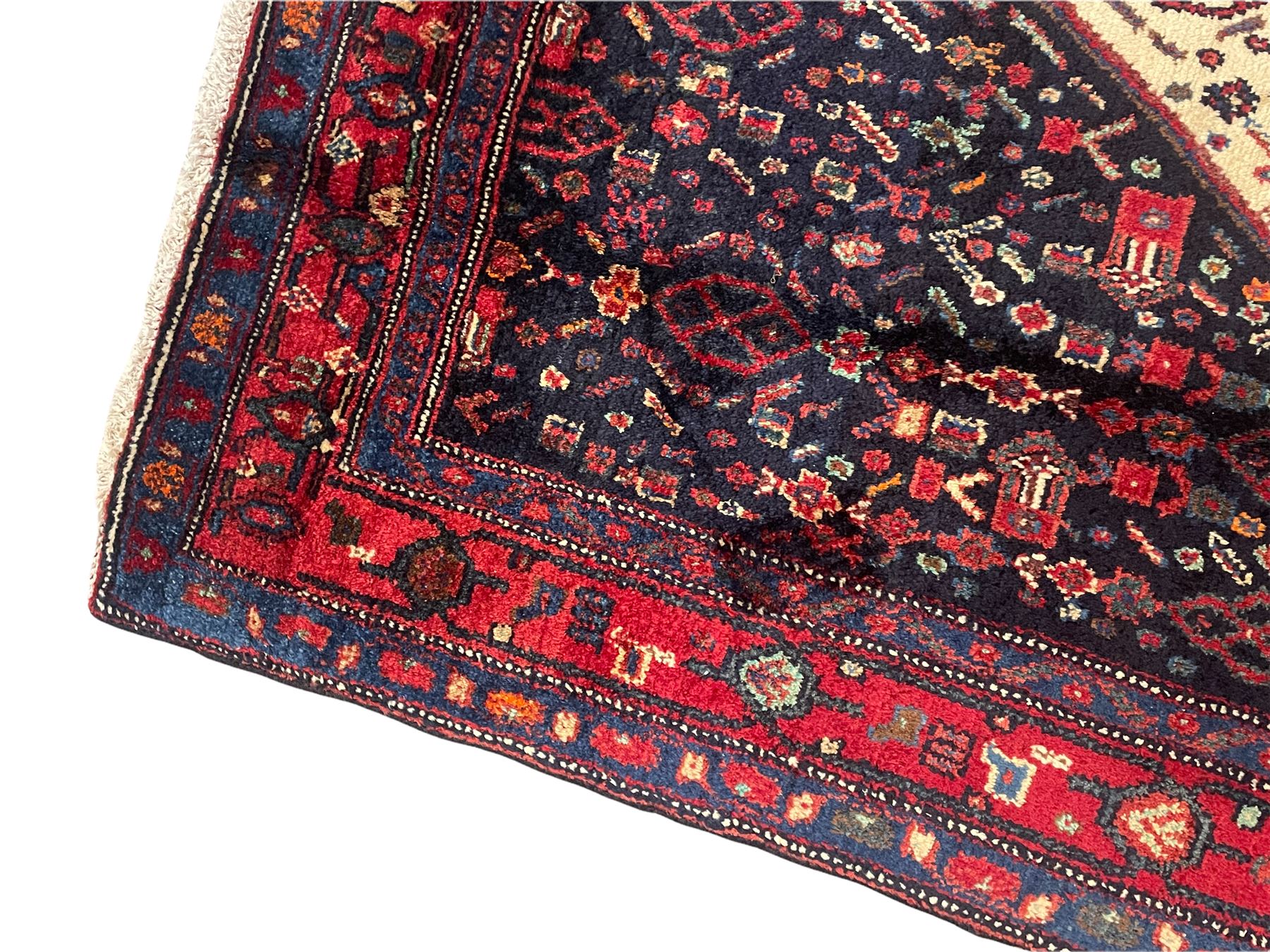 Persian Kurdish rug, blue ground field decorated with various stylised motifs and overlapped lozenge medallion, repeating guarded border