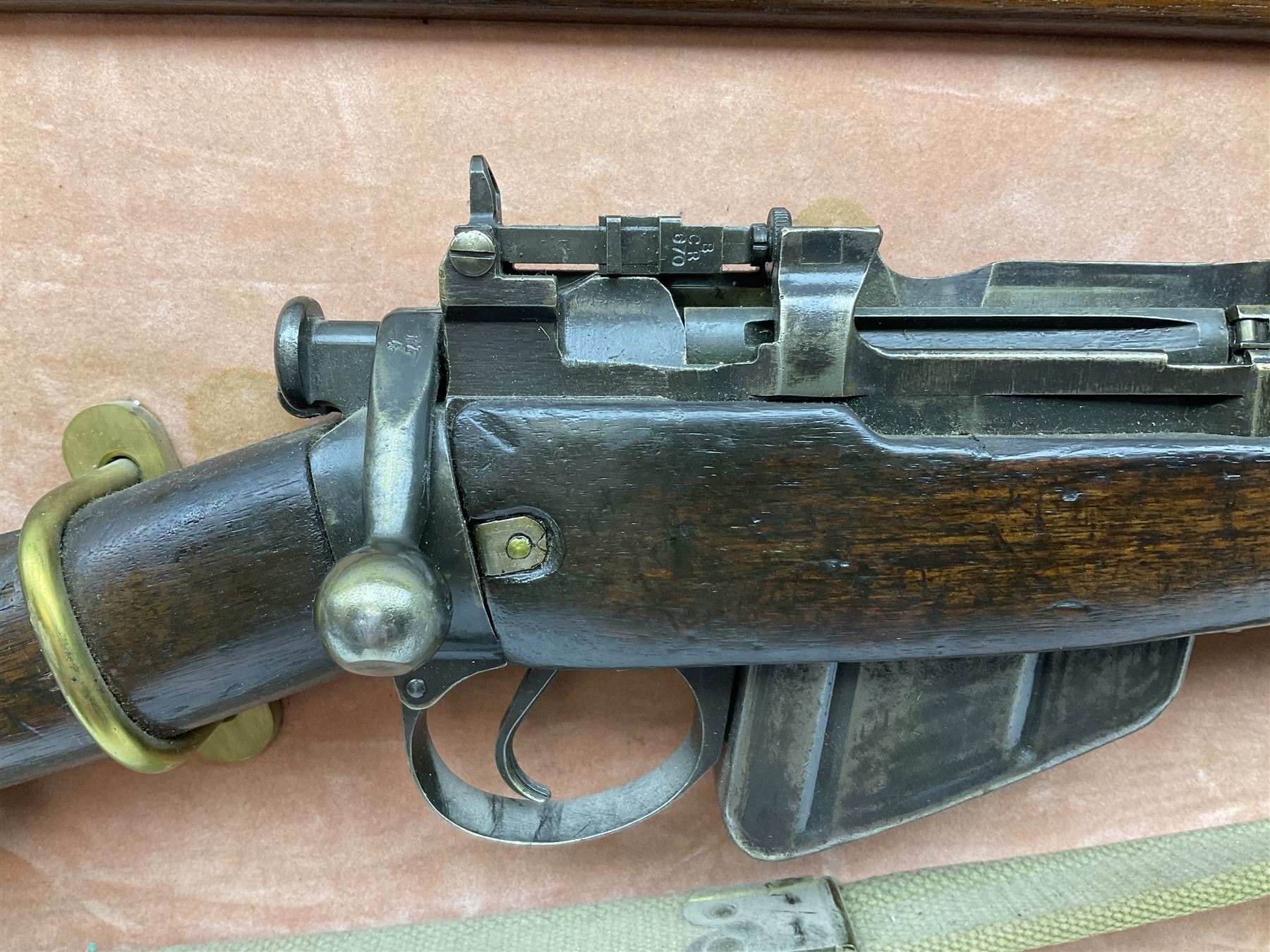 WW2 Lee Enfield No.4 Mk.1 .303 bolt-action rifle with hinged butt compartment, made by SA Ltd., Long Branch, Canada 1942, serial no.5L0646 L113cm; mounted on a framed display board with No.4 Mk.II spike bayonet, No.9 Mk.1 blade bayonet, two inert 5-round clips and brass biographical plaque by Antler Military Originals detailing DA Cert No.C3444 OLD STYLE DEACTIVATION SO FIREARMS CERTIFICATE REQUIRED OR RFD