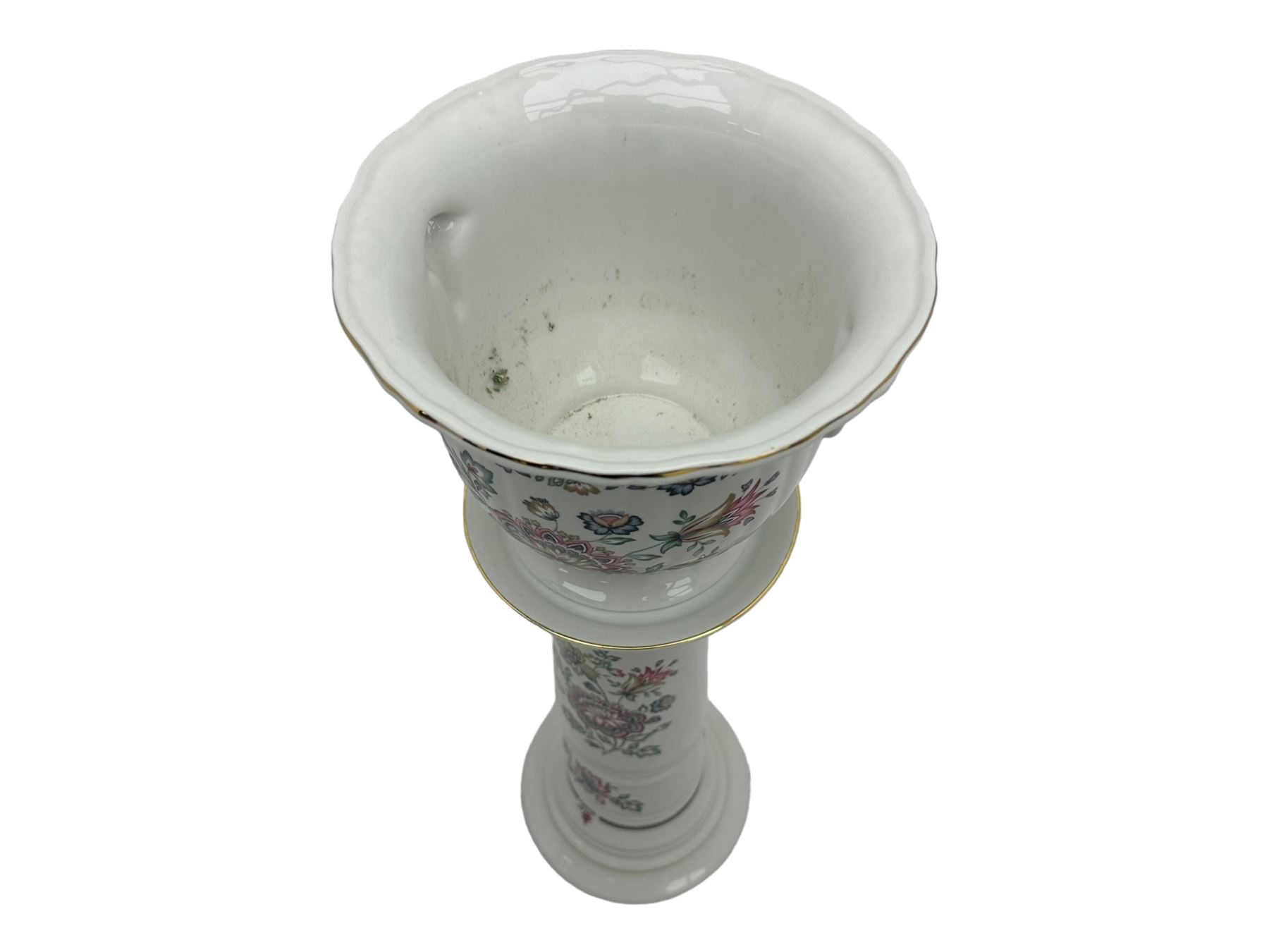 Royal Winton - early 20th century ceramic jardinière on stand, white ground with polychrome floral decoration, flared rim and twin handles, on circular base