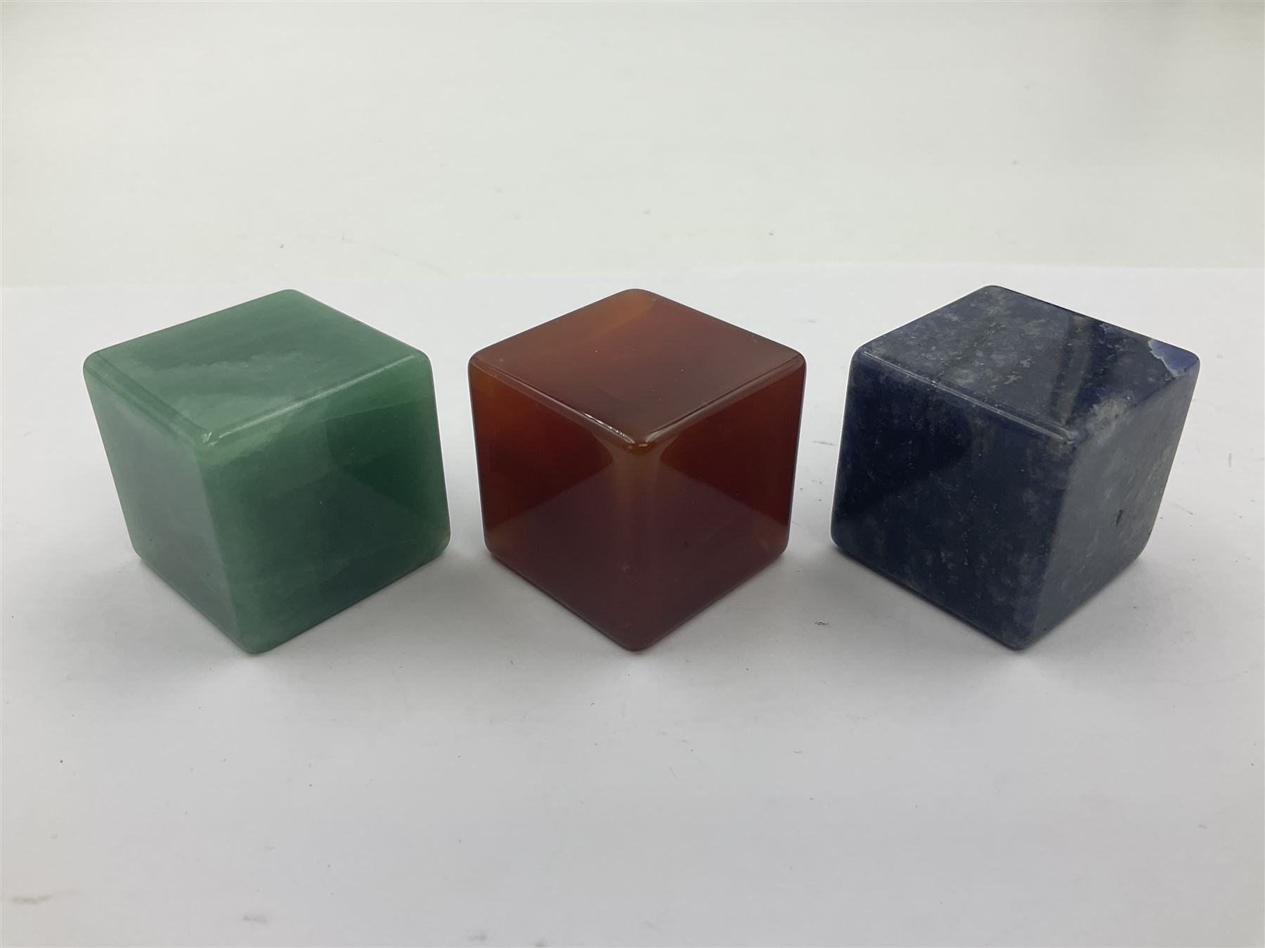Ten cube mineral specimens, each cut and polished to highlight natural formations, including tiger eye, green aventurine, rose quartz, opalite, amethyst etc, H3cm 