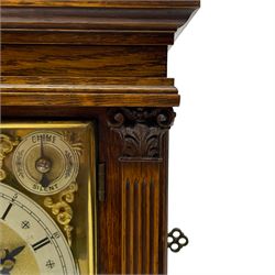 Winterhalder & Hofmeier- German 8-day oak cased mantle clock, in an architectural styled case with a gable pediment and recessed carving to the tympanum, square brass dial flanked by carved reeded pilasters and capitals, with open carved silk backed sound frets on a shaped plinth with padded feet, brass dial with cast spandrels and silvered chapter, Roman numerals, minute track and stylised gothic hands, conforming chime/silent and pendulum regulation dials, twin train going barrel movement with quarter-hour striking on two coiled gongs and the hours on one.
With pendulum.