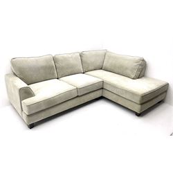 Corner sofa upholstered in light grey fabric