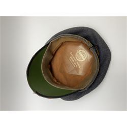 WW2 German Luftwaffe NCO grey cloth peaked cap, orange piping to the crown and bordering the central band, aluminium eagle and cockade insignias, leather strap, interior retains original sweatband inscribed 'Powton', lining has tailor's celluloid diamond marked ' Deutsche-Qualitatsarbeit Christian Haug Berlin No.18 Hochsestr 29 around a CRIHA logo'