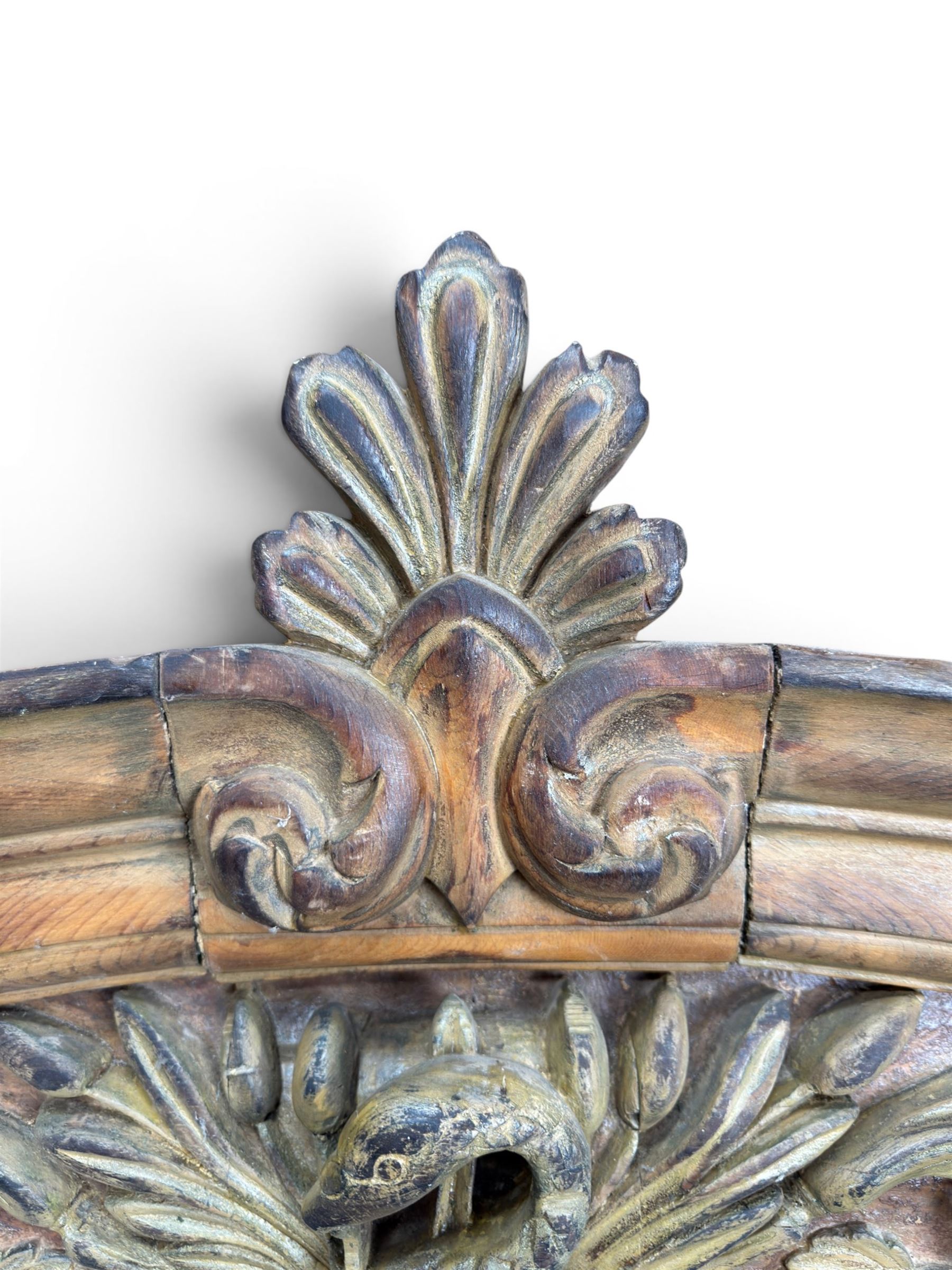 19th century carved pine architectural pediment, detailing floral swags with berries and central serpentine snake head 