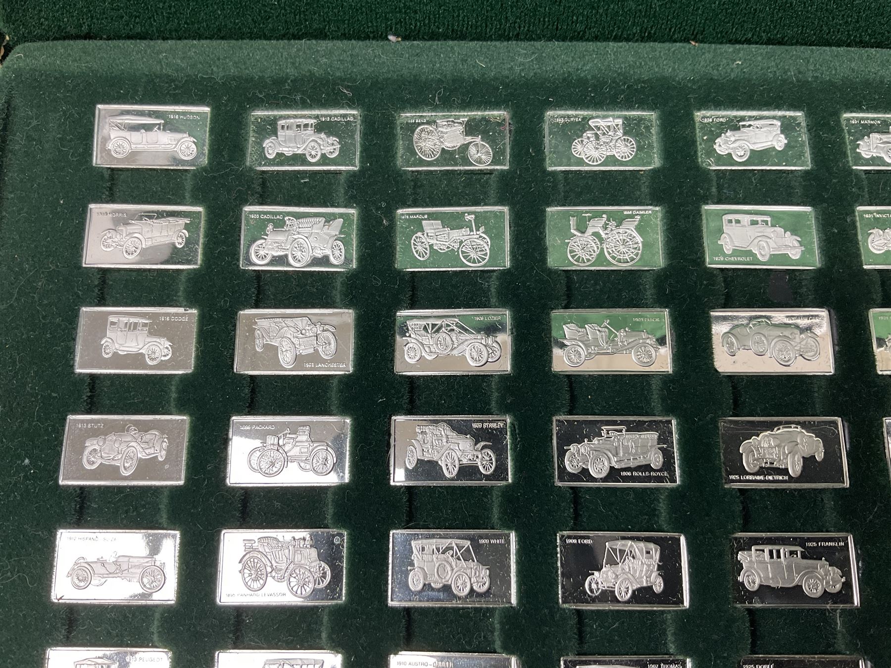 '100 Greatest Cars', set of one hundred silver miniature car ingots by John Pinchers, in presentation box 