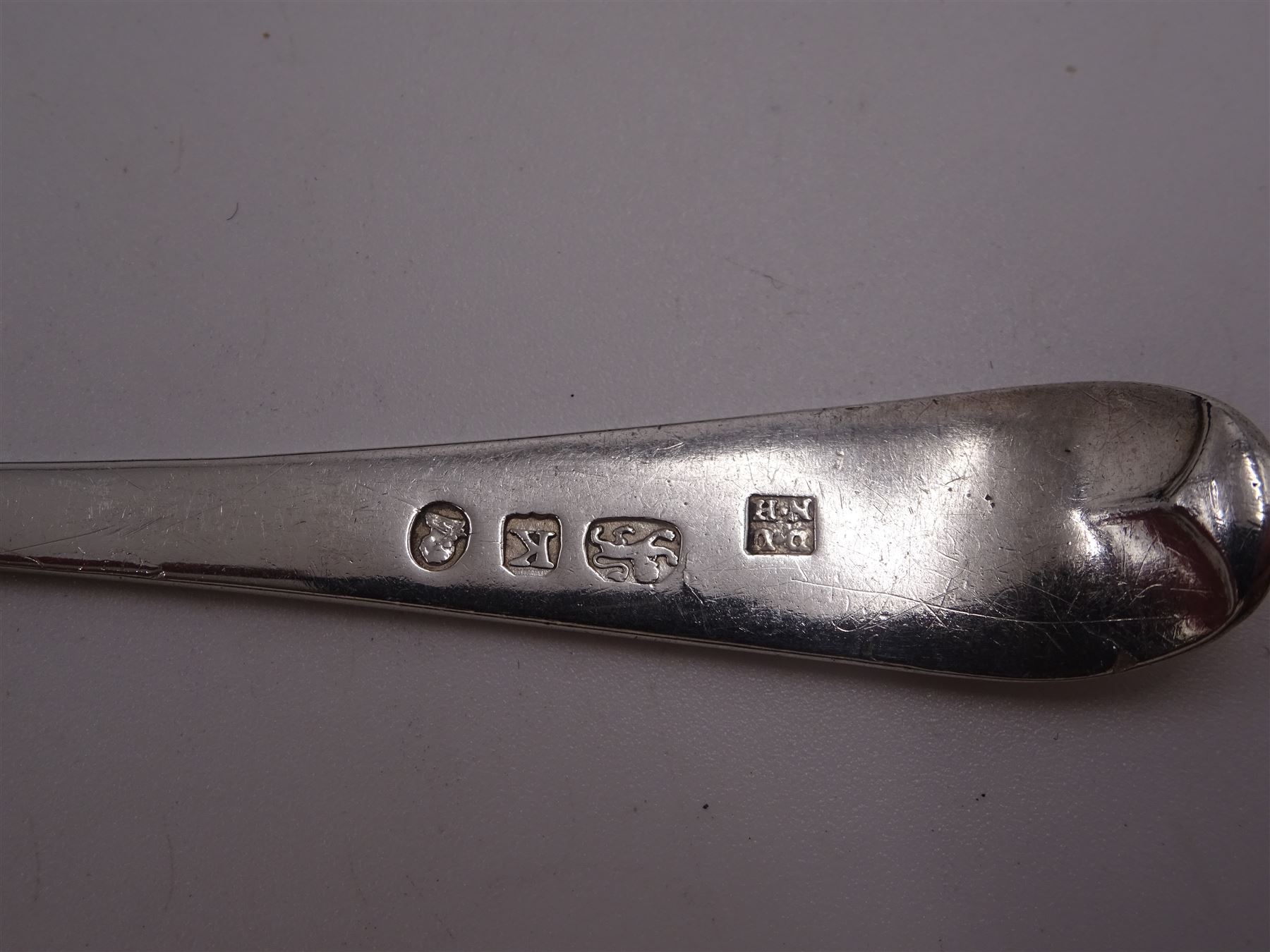 Two sets of six George III silver teaspoons, both with bright cut decoration and engraved initials, the first set hallmarked John Lambe, London 1785 and the second set hallmarked Duncan Urquhart & Naphtali Hart, London 1805