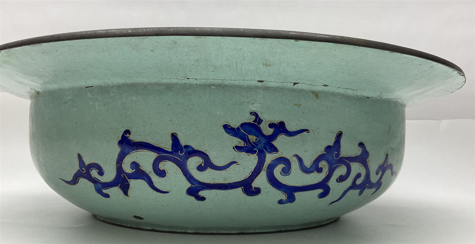 18th/19th century Chinese Canton enamel basin, the circular basin with flat everted rim, decorated with scrolling foliate and fruit decoration on a blue ground, D43cm