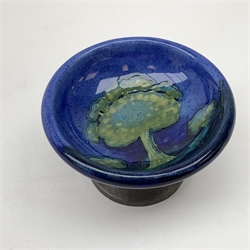 William Moorcroft for Liberty & Co, small pedestal dish, the shallow bowl decorated in the Moonlit Blue pattern, raised upon a Tudric pewter base, impressed beneath Made in England, Tudric Moorcroft 01339, H7cm, D11cm