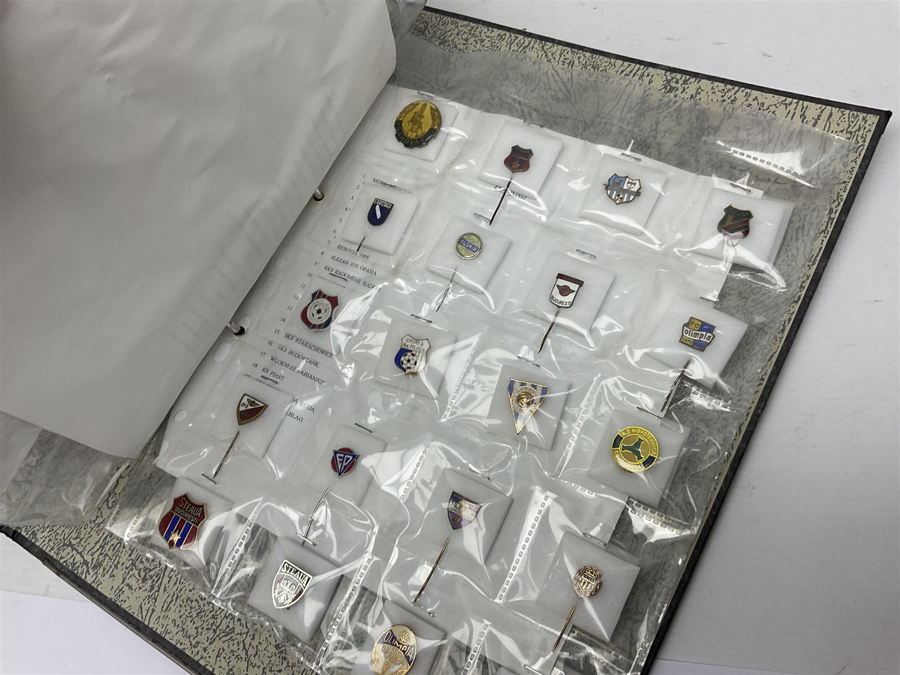 Large collection of approximately one hundred and eighty enamel badges and pins, relating to British and World football clubs, including loose examples and examples housed in folders, mostly identified