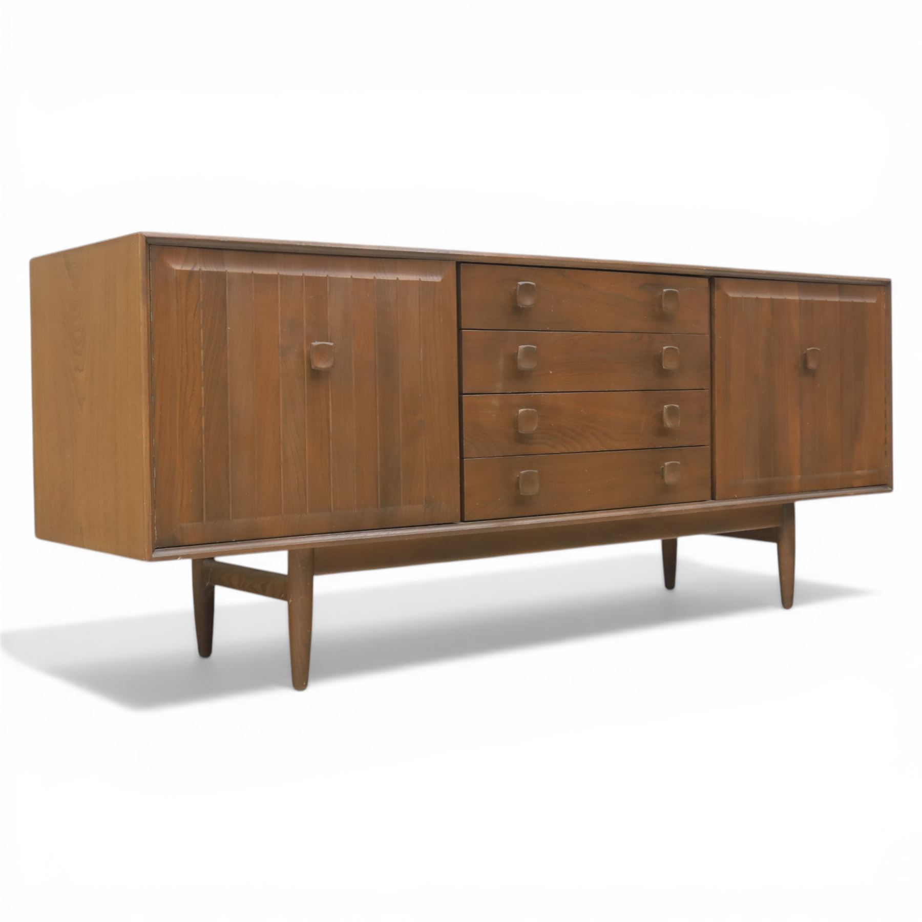Ensign - Mid-20th century elm sideboard, with a central bank of four drawers, flanked by cupboard doors, raised on tapering supports, labelled Ensign Bristow & Townsend Ltd
