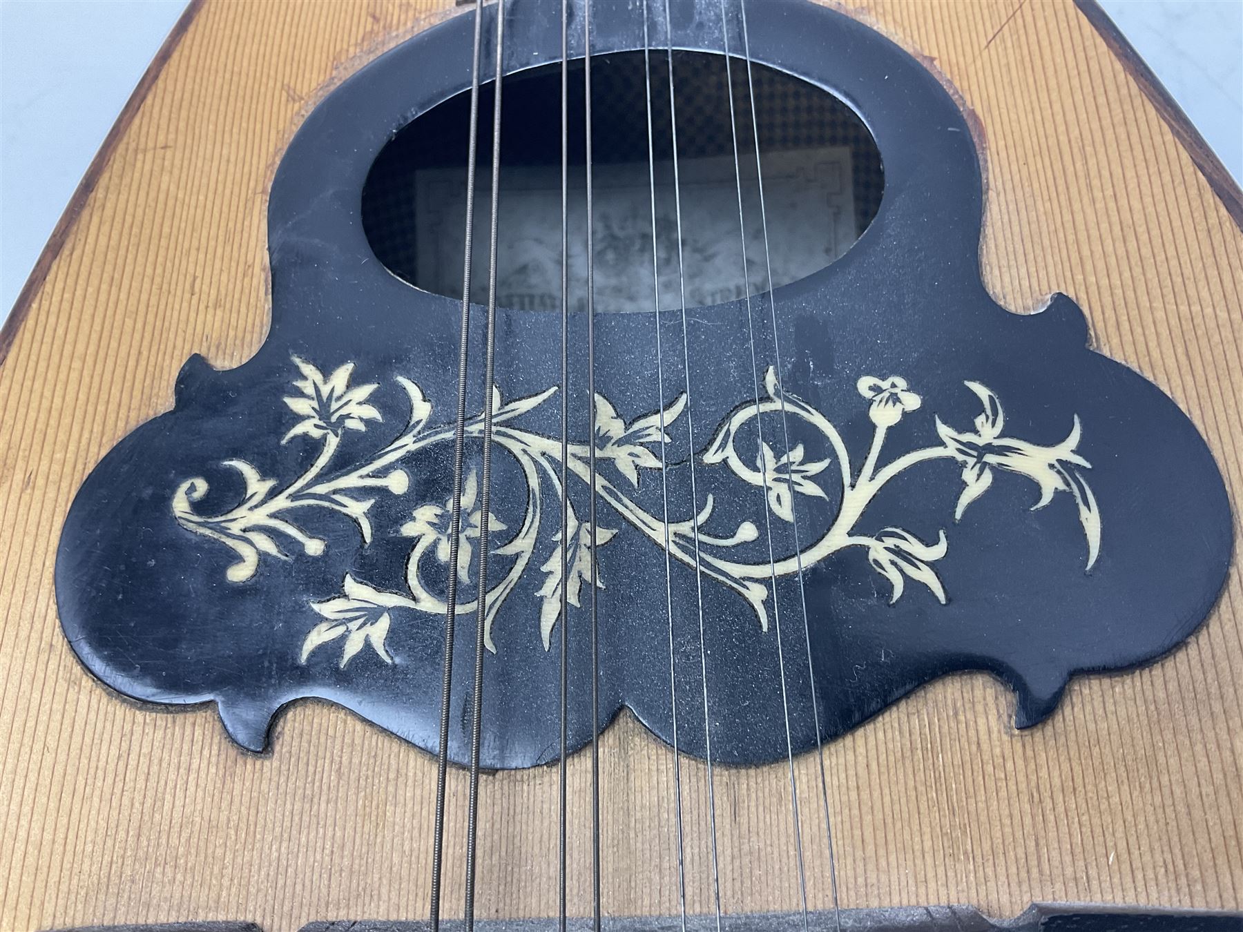 Italian mandolin, with foliate inlaid scratchplate, paper label inscribed 'Carlo Loveri & Figlio of Napoli', L62cm
