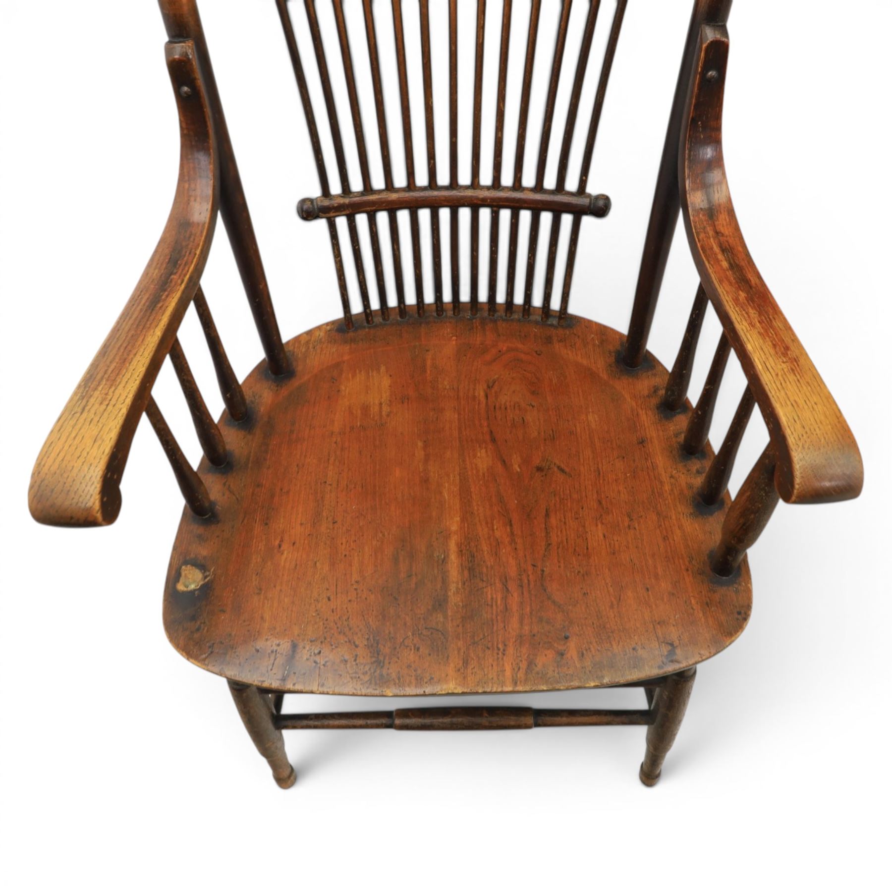Set of three 19th century ash and elm spindle back Windsor armchairs, arched top rails above fan-shaped spindle backs, curved arms with turned supports, shaped saddle seats, on turned legs joined by H-stretchers