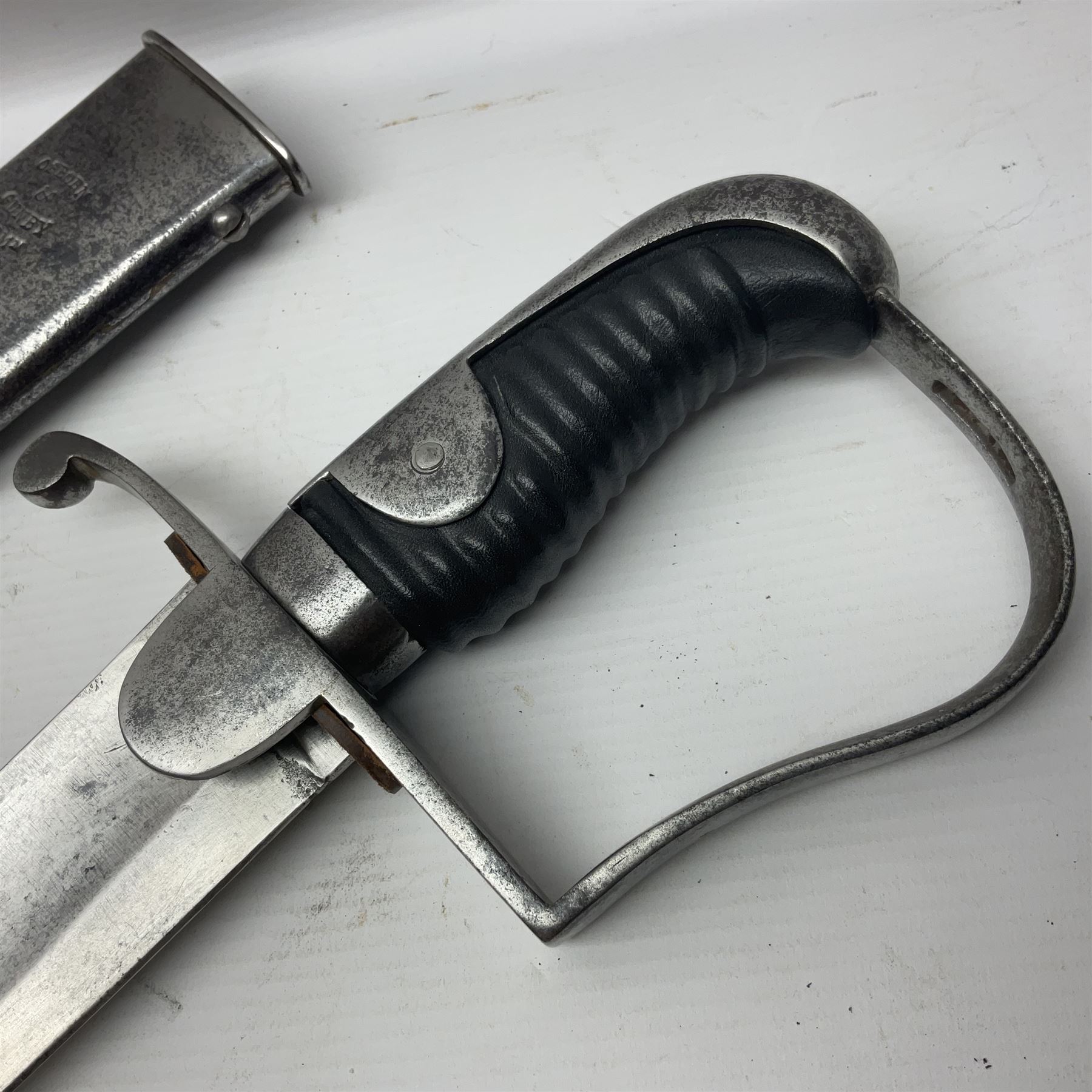 British 1796 Pattern Light Cavalry trooper's sword, the 84cm curving fullered blade stamped Hadley.1 to the back edge, steel hilt with knucklebow, D-shaped langets and leather grip; in polished steel scabbard stamped Osborn & Gunby Birmm. and W.R.16 ( ?16th Light Dragoons) with two suspension rings L100cm overall