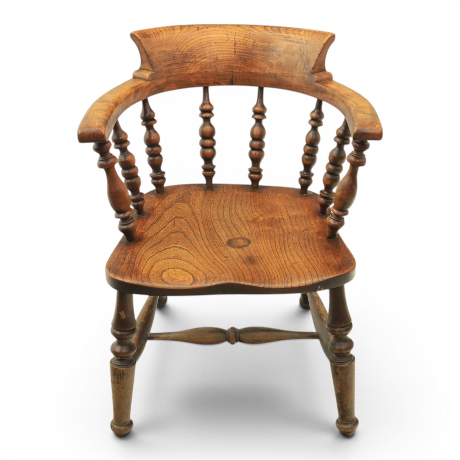 Early 20th century elm smoker's bow or captain's chair, elm dished seat raised on turned supports