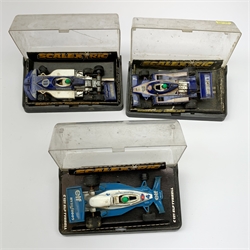 Scalextric - five slot-racing models comprising C281 Red Motorcycle Combination, C134 Elf Renault RS-01, C137 Ligier  JS11, C129 march Ford 240 and C121 Elf Tyrrell, all in perspex boxes; and four other perspex boxed slot-racing models (9)