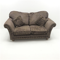 Two seat sofa upholstered in aubergine embossed fabric, turned supports, W190cm